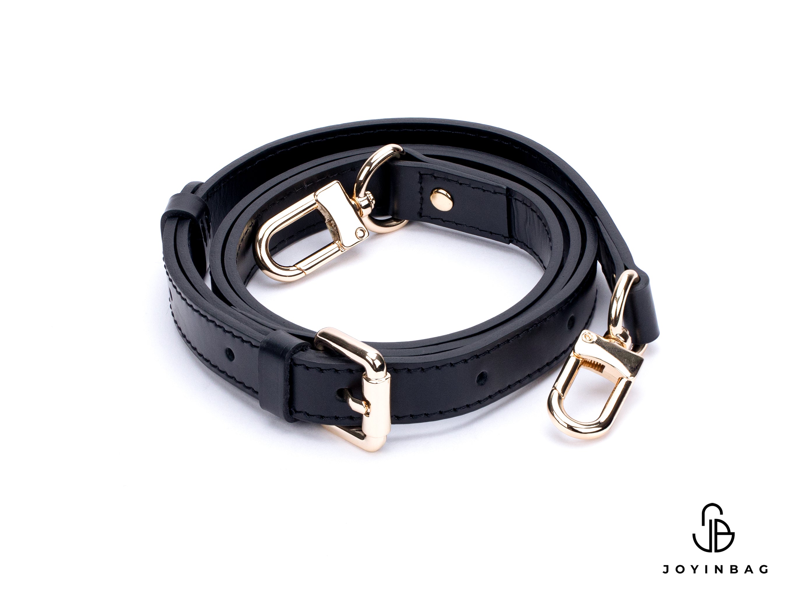 Adjustable black vachetta strap with clasp closure at both ends.