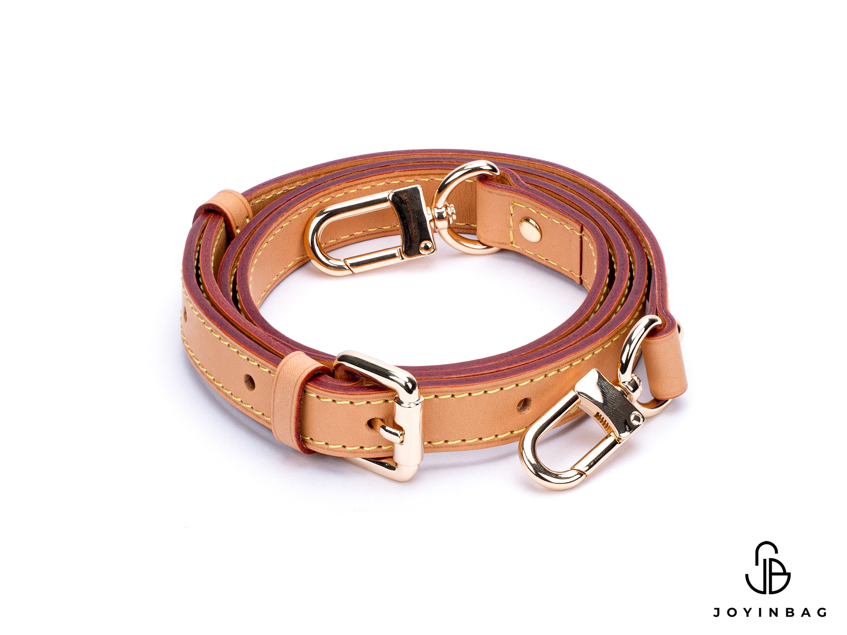 Adjustable honey vachetta strap with clasp closure at both ends.