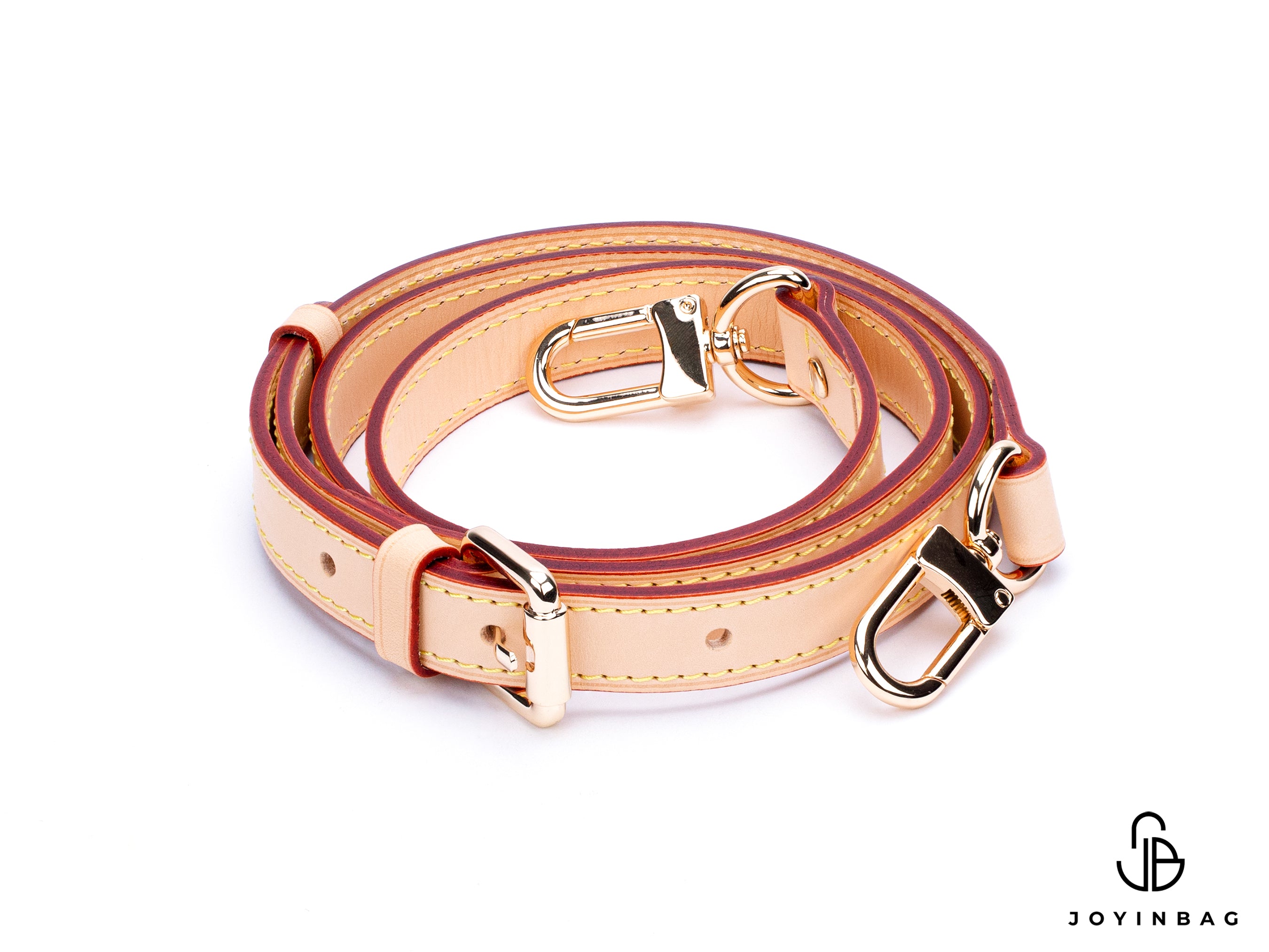 Adjustable natural vachetta strap with clasp closure at both ends.
