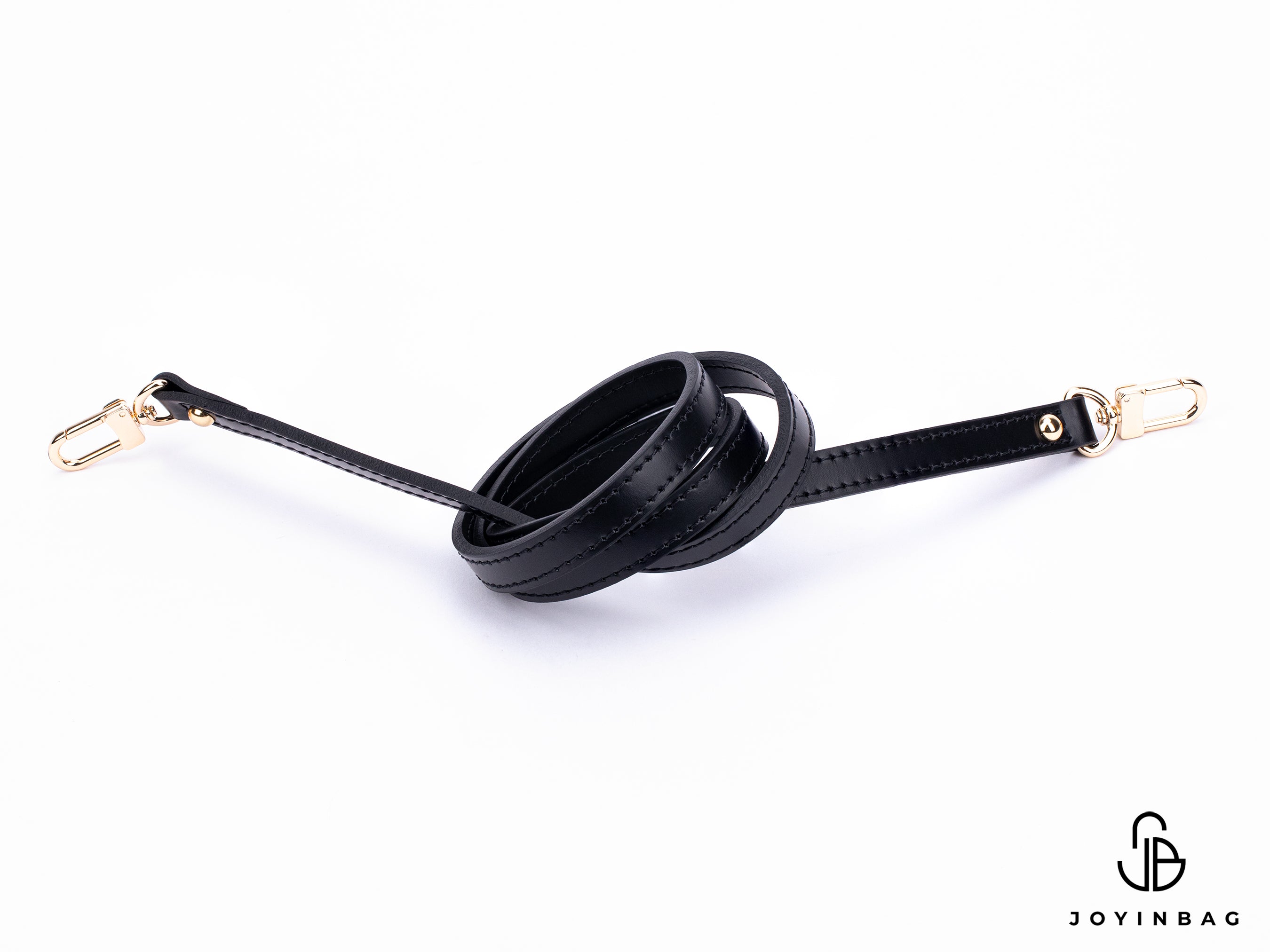 Black vachetta strap with clips on both ends.
