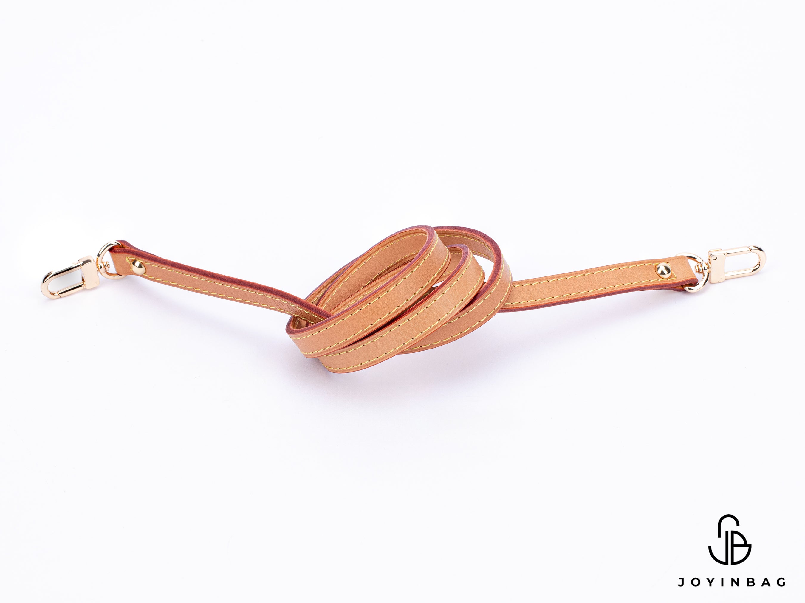 Honey vachetta strap with clips on both ends.