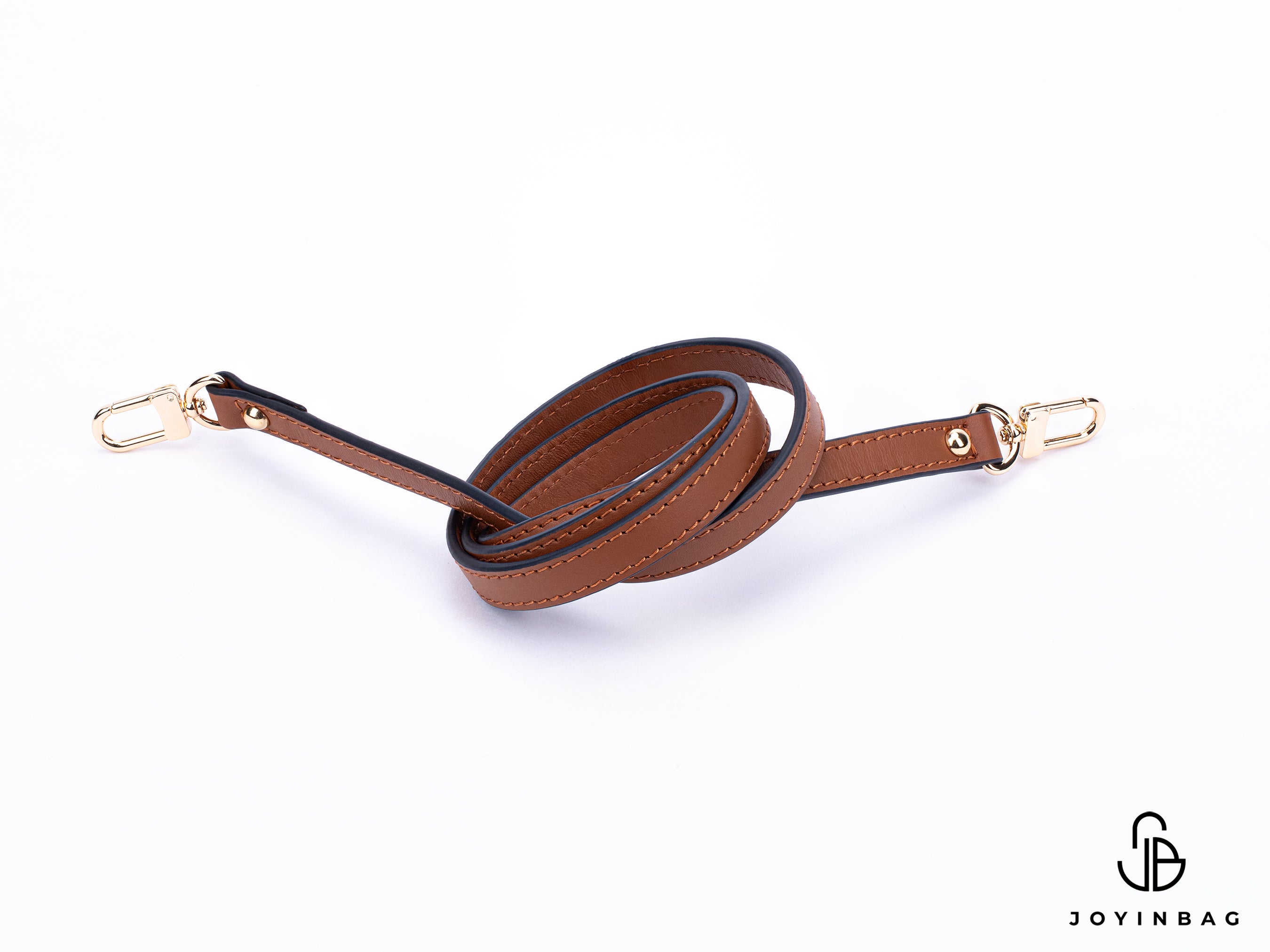 Brown vachetta strap with clips on both ends.