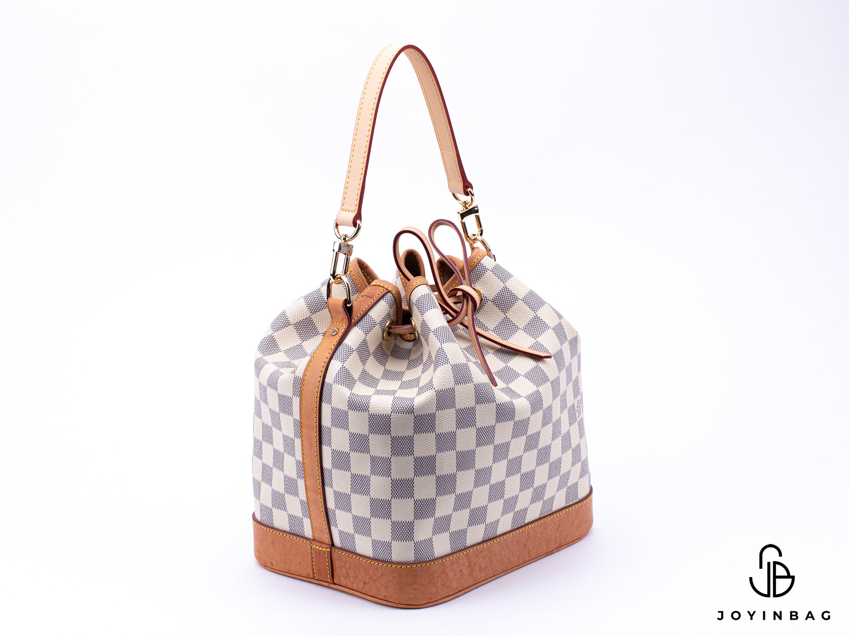 A top-handle shoulder strap in natural vachetta is displayed with an additional image showing the strap attached to a Louis Vuitton Noe.
