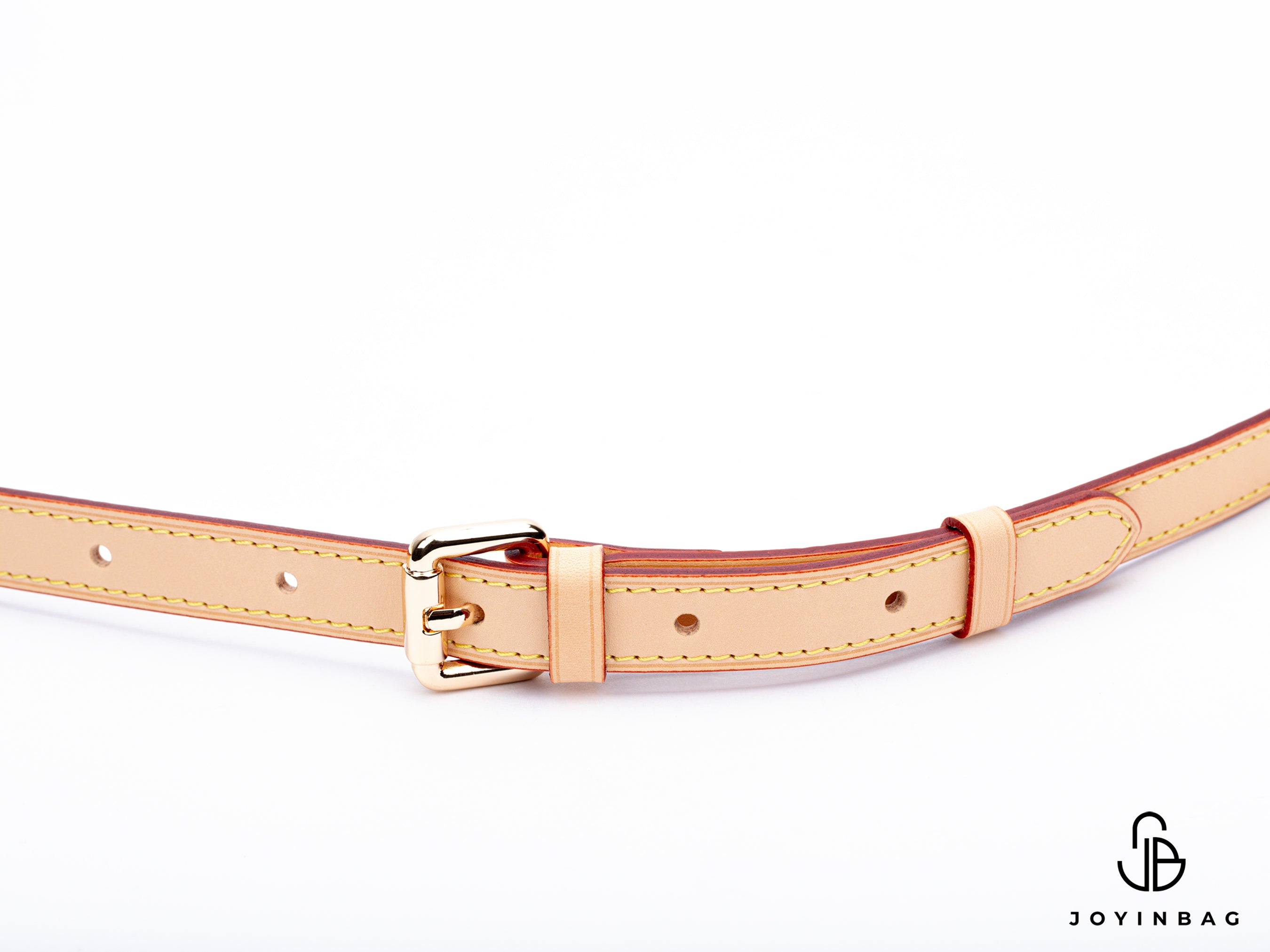 Adjustable natural vachetta strap with clasp closure at both ends.
